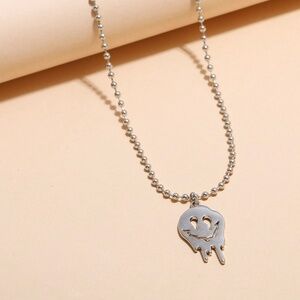 90s inspired dripping smiley face silver necklace